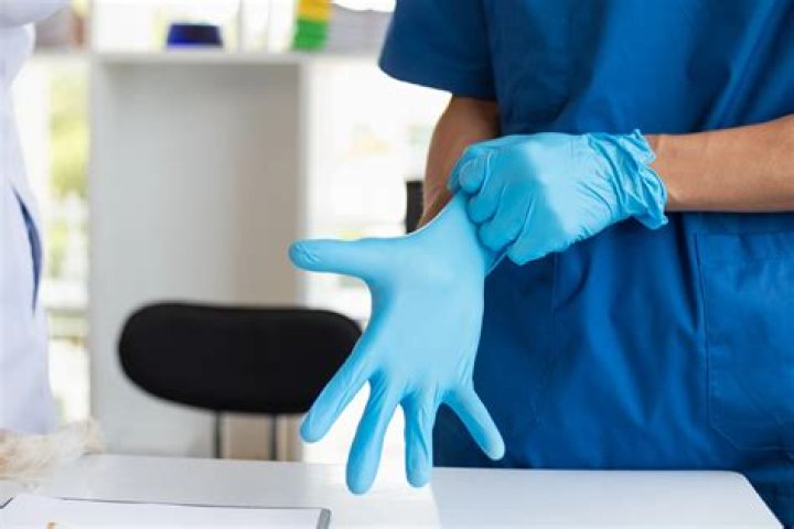 What are the right procedures for wearing the operating gown and sterile gloves?