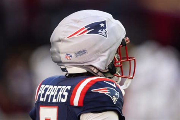 Why do football helmets have stripes?